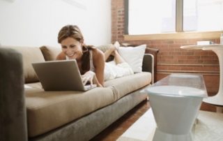 Young adult woman using laptop computer